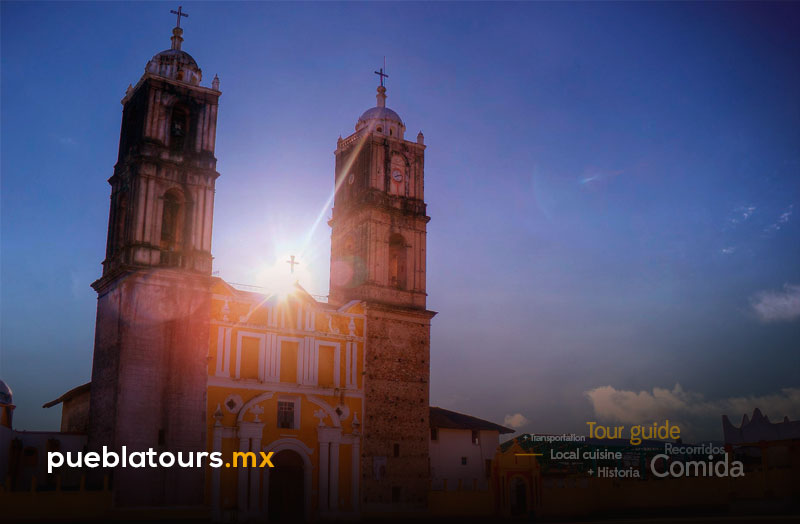 Woman sitting at a viewpoint overlooking the valley and mountains of Tlatlauquitepec